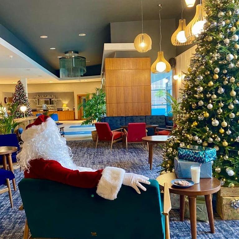 Santa in lobby with milk